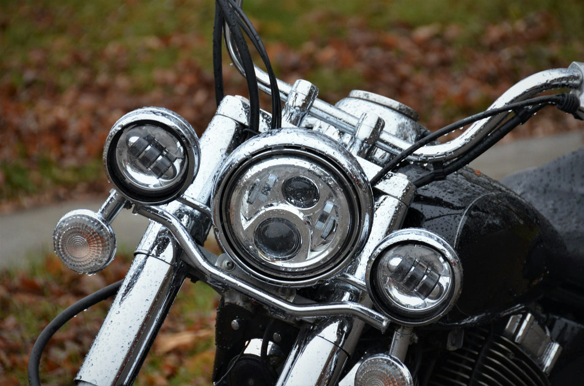 a close up of a motorcycle's headlight and handlebars