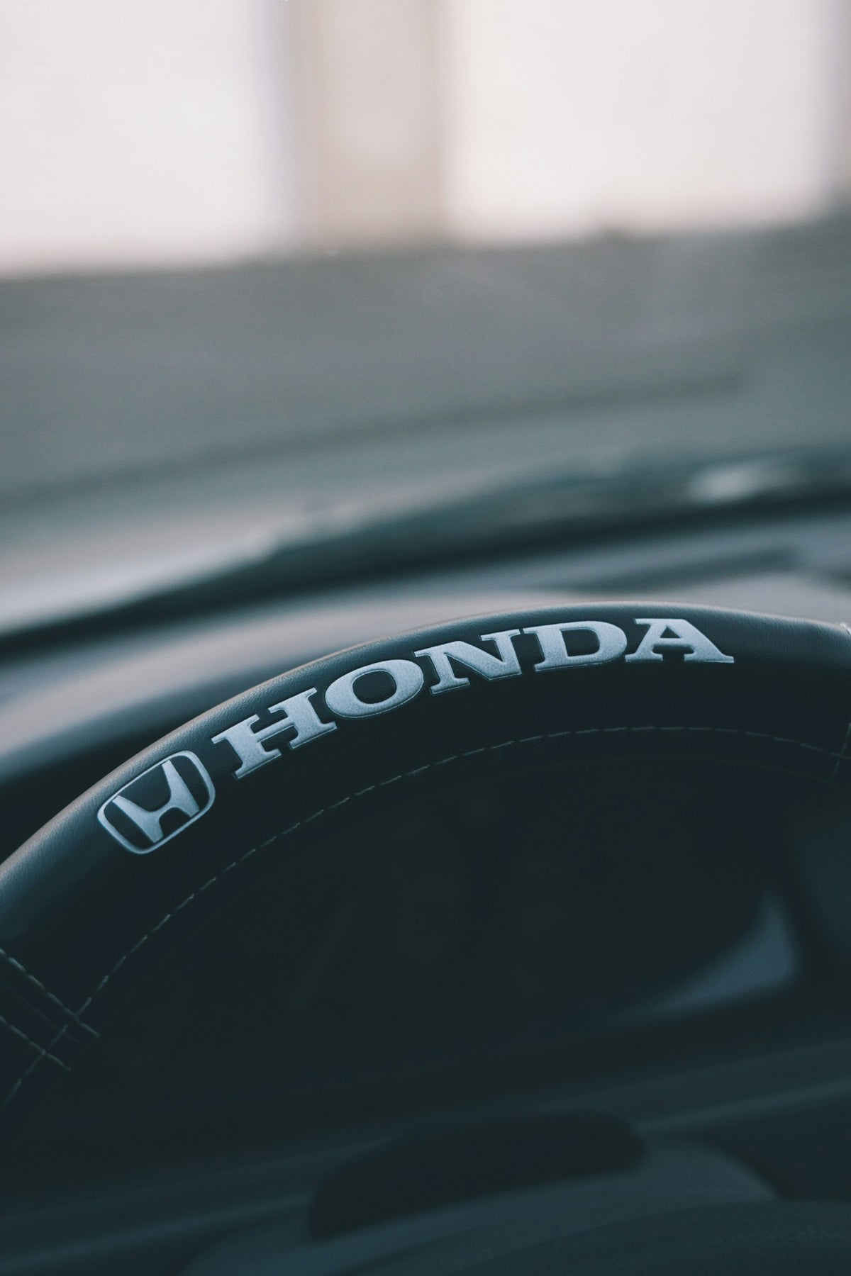 a close up of a steering wheel on a car