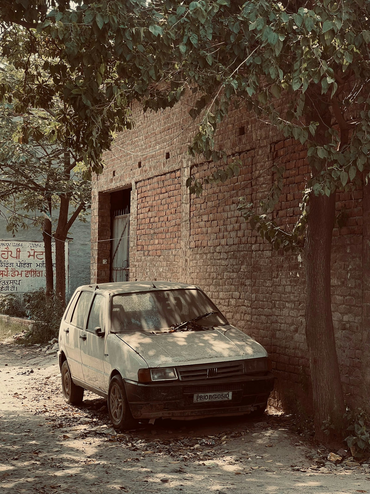 a car parked in front of a brick building